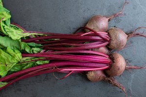 a carefully placed pile of harvested beetroot plants